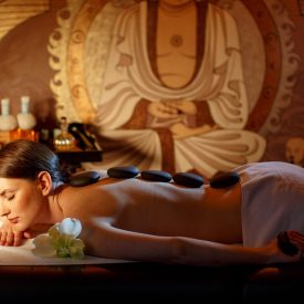 beautiful-woman-is-relaxing-spa-with-hot-stones-her-body-cosmetic-therapy-thai-massage-w-less